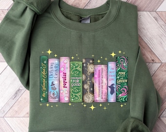 Sudadera con el libro "Witched Changed For Good", cuello redondo con varita mágica de "Defy Gravity Broomstick", camiseta literaria popular y moderna, un bonito regalo para un fan de la música.