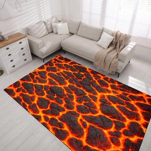 May include: A rug with a realistic lava flow design. The rug features a dark grey background with bright orange and red lava flowing through it.