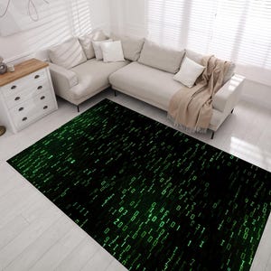 May include: A black and green area rug with a digital pattern of green numbers and lines on a black background.
