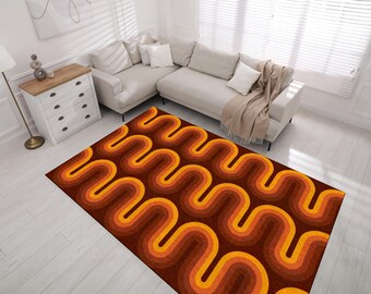 Puede incluir: Una alfombra marrón y naranja con un patrón ondulado abstracto. La alfombra tiene un estilo retro de los años 70.