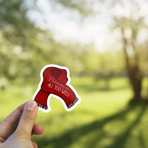 May include: Red scarf sticker with the text "I remember it all too well" on a white background.