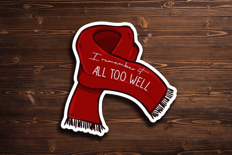 May include: Red scarf sticker with white outline and the text "I remember it all too well" written on it.