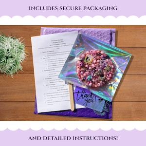 May include: A package with a purple bubble mailer, instructions, and a clear bag containing a pink and purple beaded item. The clear bag has a holographic sheen. A small card says "thank you!"