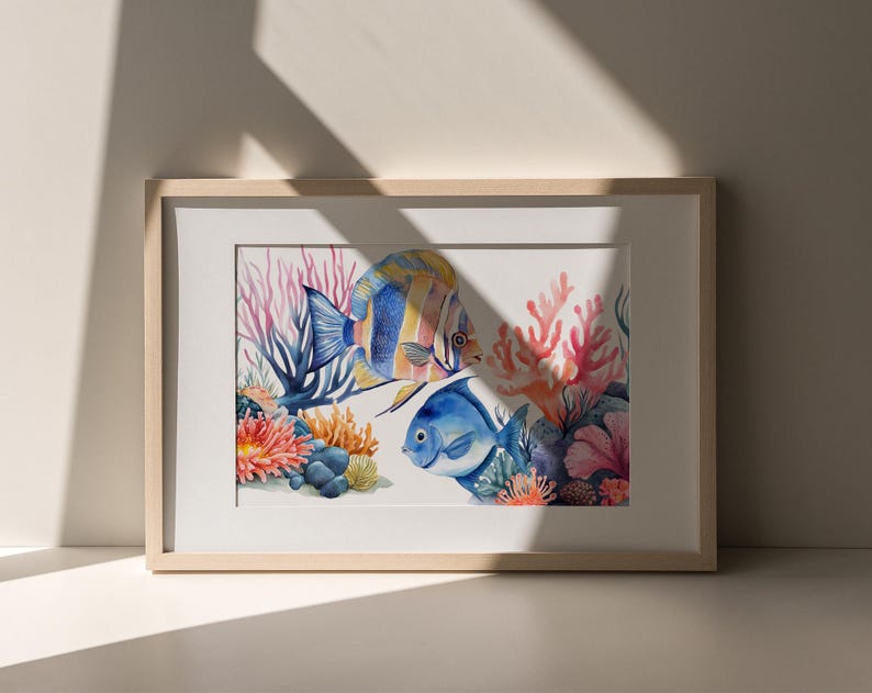 May include: A framed watercolor painting of two colorful fish swimming among coral reefs. The fish are blue, yellow, and orange, and the coral is pink and red.