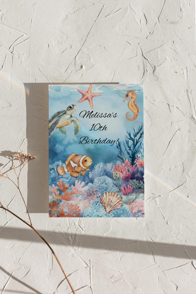 May include: A blue and green watercolor illustration of a sea turtle, a starfish, a seahorse, and a clownfish swimming in a coral reef. The text "Melissa's 10th Birthday!" is written in black cursive font.