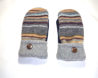 May include: A pair of handmade mittens with a striped pattern in shades of gray, tan, blue, and burgundy. The cuffs are gray and feature a wooden button. These cozy mittens are perfect for cold weather.