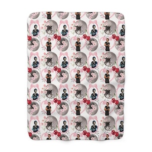 May include: White blanket featuring a repeating pattern of a person, disco balls, cherries, pink bows, and floral accents. The design is a collage of various elements, creating a whimsical aesthetic. The blanket has a soft, plush appearance.