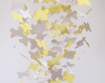 Móvil de cuna de mariposa amarillo y blanco