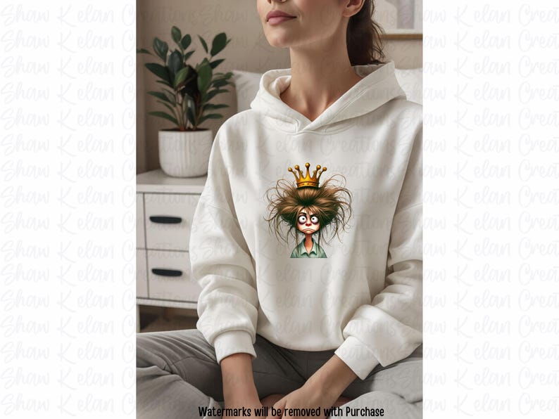 May include: A white hoodie with a graphic of a cartoon character wearing a crown. The character has messy brown hair and a surprised expression.