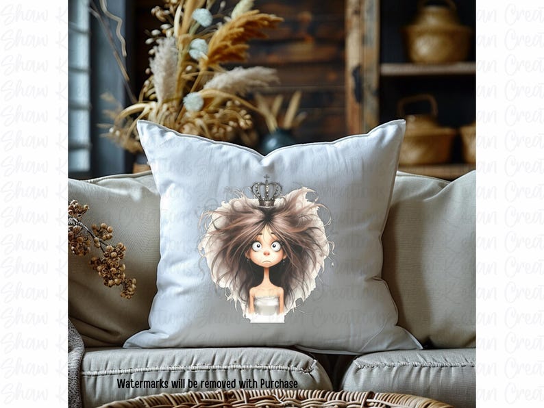 May include: A white pillow with a cartoon illustration of a girl with brown hair wearing a crown. The girl has large eyes and a surprised expression.