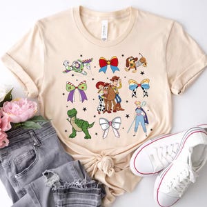 Coquette Bows Watercolor Disney Toy Story Shirt, Disney Toy Story T-Shirt, Woody Jessie Buzz Alien Rex Tee, Disneyland Family Matching Trip
