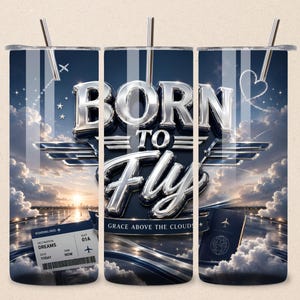 May include: A stainless steel tumbler with a blue sky and cloud design. The words "BORN TO FLY" are prominently displayed, along with a boarding pass and passport graphic. The tumbler has a silver straw.