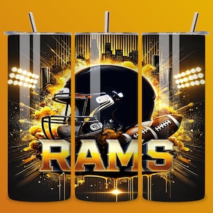 May include: A black and gold tumbler with a football helmet and the word "RAMS" in a stylized font. The background is a black and gold explosion of color.