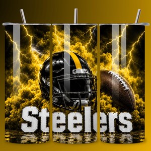 May include: A cylindrical tumbler featuring a black football helmet with a yellow stripe, a brown football, and yellow lightning bolts against a dark background. The word Steelers is printed in large white block letters at the bottom.