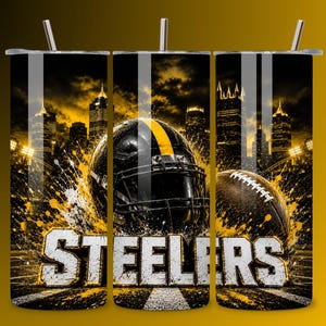 May include: A cylindrical tumbler featuring a black and yellow graphic design with a football helmet, a football, and a city skyline. The word STEELERS is printed in large white block letters at the bottom. The tumbler includes a lid and a straw.