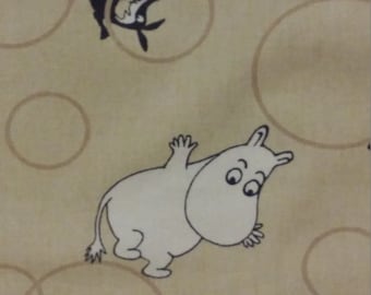 Lovely  moomin fabric with moominmamma little my beige background