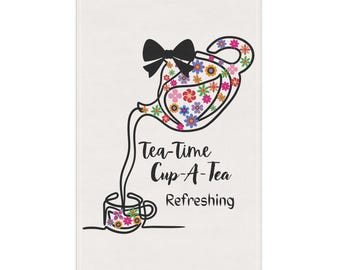 May include: White rectangular tea towel featuring a black outline illustration of a teapot pouring into a teacup. The teapot and teacup are decorated with colorful flowers. The text "Tea-Time Cup-A-Tea Refreshing" is below the teapot.