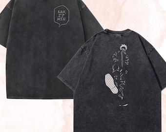 May include: A charcoal gray acid-wash t-shirt featuring a speech bubble on the front with the text NAH, I'D WIN. The back of the shirt displays a white line-art graphic of a figure with a shoe print and scattered geometric shapes.
