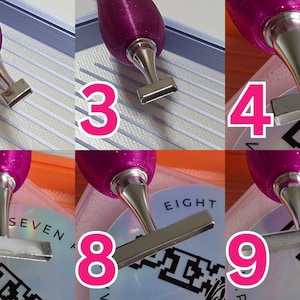 May include: A collection of ten diamond painting pens, each featuring a purple handle and silver metal tips. The tips are diverse, with a single-dot tip and various rectangular and angled flat tips. Numbers 1 to 10 are visible beside each pen.