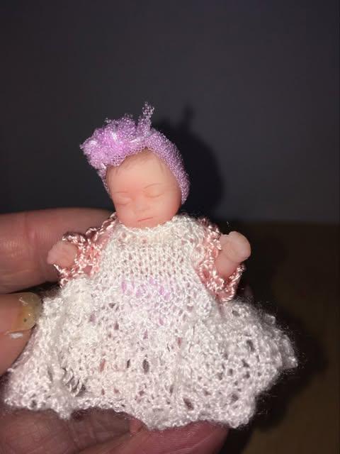 Tiny Baby doll with hand knitted dress. Fully clothed fully removable outfit