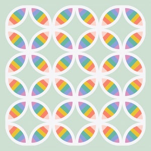 May include: A repeating pattern of white ovals, each containing a rainbow-colored stripe design. The ovals are arranged in a grid pattern on a light green background. The rainbow stripes include shades of pink, orange, yellow, green, blue, and purple.