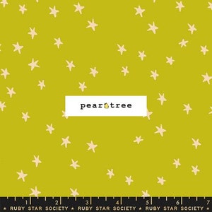 May include: A yellow fabric with a white star pattern. The fabric has the text "pear tree" printed on it.