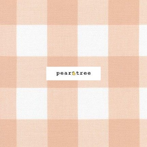 May include: A peach-colored and white gingham pattern fabric with the text "peartree" in the center.