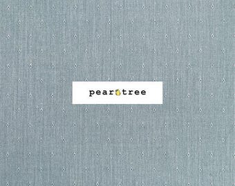May include: A light blue fabric with a subtle diamond pattern. The fabric has a textured appearance and a white rectangular logo with the text "pear tree" and a pear icon.