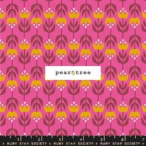 May include: Pink fabric with a repeating pattern of yellow stylized flowers with white centers and brown stems. The fabric has the text "pear tree" printed on it.