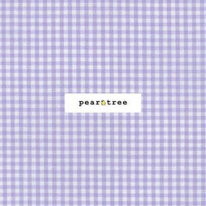 May include: A close-up of a fabric with a gingham pattern in light purple and white. The text "pear tree" is displayed on a white rectangular label.