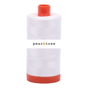 May include: A white spool of thread with an orange top and bottom. The spool is labeled "peartree" in black text.