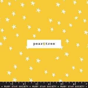 May include: Yellow fabric with a white star pattern. The fabric has the text "pear tree" printed on it.