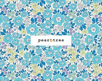 May include: A fabric with a floral pattern featuring blue, light blue, yellow, and purple flowers on a white background. The fabric has a ruler along the bottom with measurements in inches. The text "pear tree" is in a white rectangle.