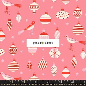 May include: A pink fabric featuring a repeating pattern of white and red Christmas ornaments and birds, with small white stars scattered throughout. A white rectangular label with the text pear tree is centered, and a ruler is visible at the bottom.