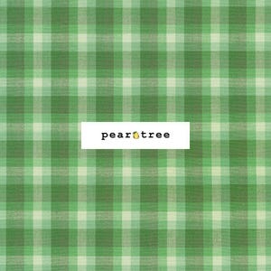 May include: Green and white plaid fabric with the text "peartree" in the center.