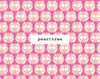 May include: Fabric featuring a repeating geometric pattern of pink, light pink, and cream triangles arranged in a fan-like motif. A white rectangular label displays the text pear tree with a pear icon. A black ruler shows 7 inches.
