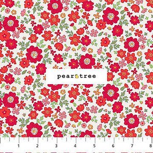 May include: Floral fabric with a white background and a pattern of red and pink flowers, green leaves, and small yellow accents. The fabric has a ruler along the bottom with measurements in inches. The text "pear tree" is in a white rectangle.