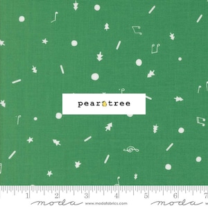 May include: Green fabric with a repeating pattern of white musical notes, stars, dots, and Christmas trees. The fabric has a ruler along the bottom and the text "pear tree" in a white rectangle.