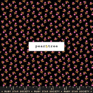 May include: A black fabric featuring a repeating pattern of small pink flowers with orange stems and leaves. A white rectangular label in the center displays the text pear tree with a pear icon. A ruler at the bottom shows 7 inches.