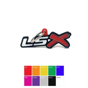 May include: A red and white LSX keychain with a silver key ring. The keychain is made of rubber and has a red X with a white outline. The keychain is a great way to show your love for the LSX brand.