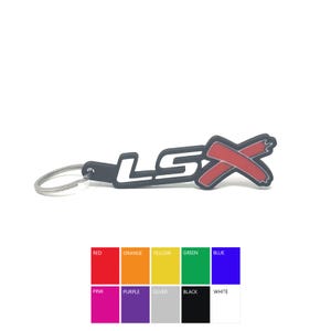 May include: Black rubber keychain with a white "LSX" logo and a red X. The keychain is attached to a silver metal ring.