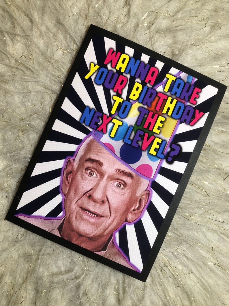 May include: A greeting card with a black border and a white and black striped background. The card features a photo of a man wearing a colorful party hat and the text "Wanna take your birthday to the next level?"