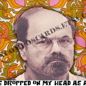 May include: A black and white photo of a man with a mustache and glasses. The photo is superimposed on a background of a colorful floral pattern. The text "i was dropped on my head as a kid." is at the bottom of the image.
