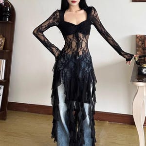 Women's Gothic Irregular Dress | Flare Sleeve Alternative Fashion | Neckline Asymmetrical Hem Dress | Gift For Her
.
Women’s gothic lace dress with sweetheart neckline, flare sleeves, and high-low hemline, styled with knee-high boots for a dramatic alternative fashion look.