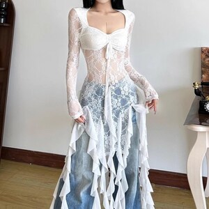 Women's Gothic Irregular Dress | Flare Sleeve Alternative Fashion | Neckline Asymmetrical Hem Dress | Gift For Her
.
Women’s gothic lace dress with sweetheart neckline, flare sleeves, and high-low hemline, styled with knee-high boots for a dramatic alternative fashion look.