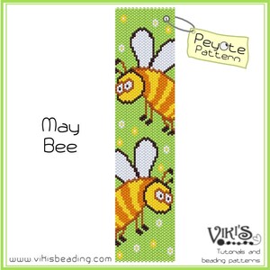 May include: A beading pattern for a May Bee bookmark. The pattern features two cartoon bees with yellow and brown stripes, white wings, and black eyes. The pattern is on a green background with white flowers. The text "Peyote Pattern" is on a yellow tag.