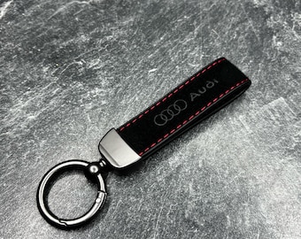 Audi keyring made of black Alcantara with red stitching and metal elements