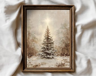 May include: A framed winter landscape painting featuring a snow-covered evergreen tree beneath a bright star. The artwork has a vintage aesthetic with a brown wooden frame and a soft, muted color palette.
