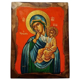 Può includere: Icona religiosa raffigurante la Vergine Maria con il Bambino Gesù, su sfondo rosso con dettagli dorati. L'opera è incorniciata in una cornice di legno scuro.