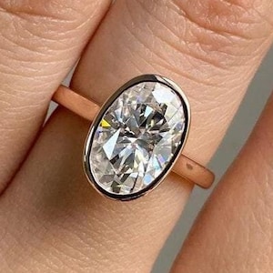 Alliance ovale en moissanite : solitaire serti clos en or rose 18 carats